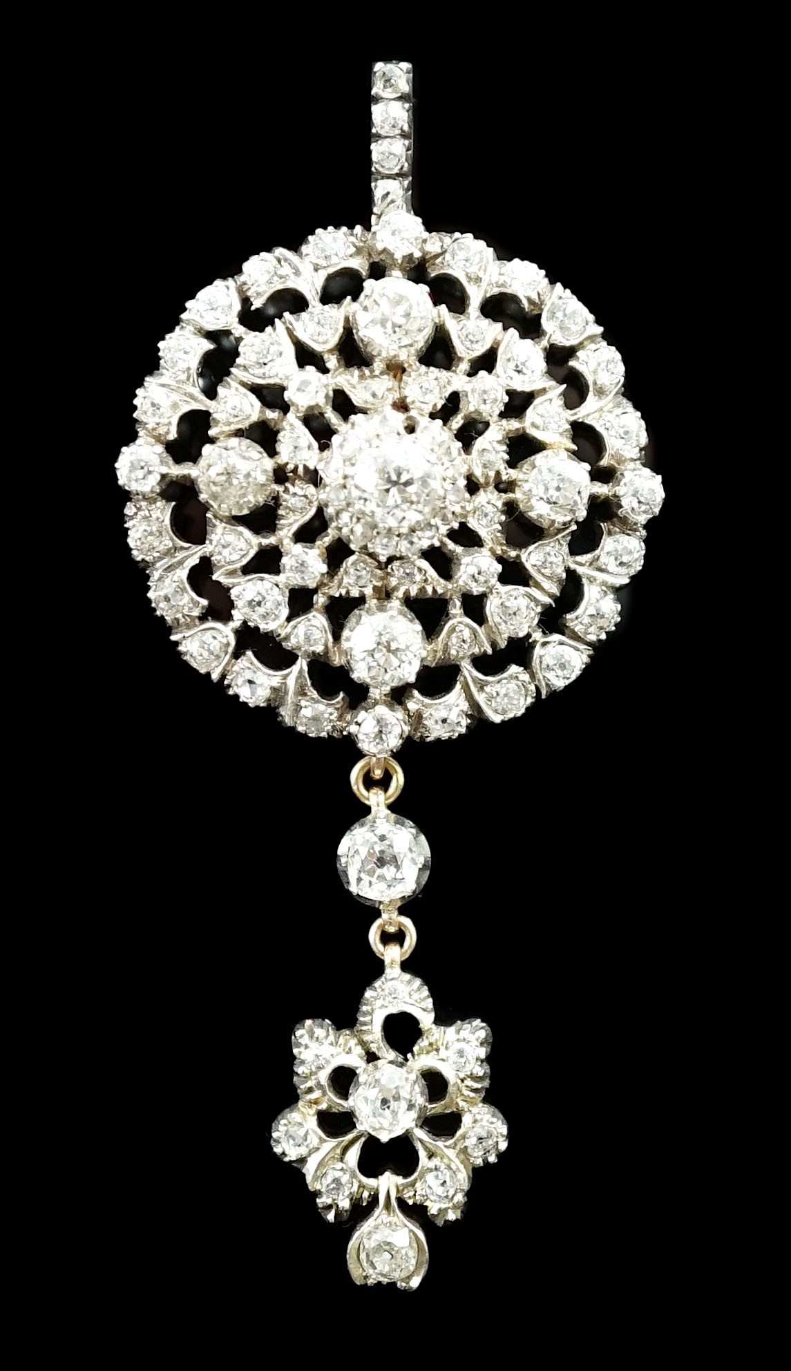 A Victorian gold, silver and graduated diamond cluster set target drop pendant brooch, retailed by Carlo & Arthur Giuliano